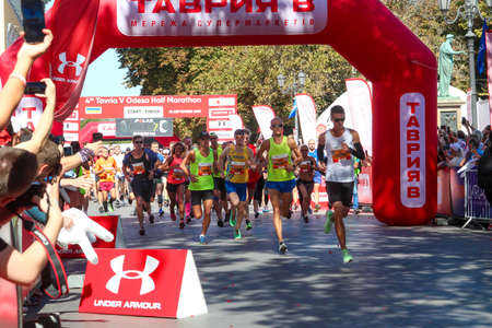 ODESSA, UKRAINE - CIRCA SEPTEMBER, 2019: Marathon runners on start of half-marathon in Odessa. Concept of competition, training, activity.のeditorial素材