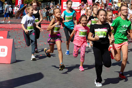 ODESSA, UKRAINE - CIRCA SEPTEMBER, 2019: Kids running half-marathon in Odessa. Concept of child athlete running.のeditorial素材