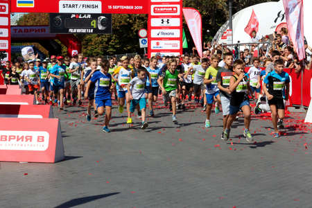 ODESSA, UKRAINE - CIRCA SEPTEMBER, 2019: Kids running half-marathon in Odessa. Concept of child athlete running.のeditorial素材