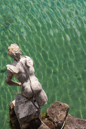 Statue of an angel without wingsの写真素材