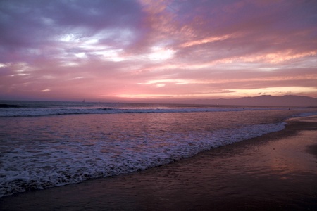 Ocean Waves Surf at Beach Shore Sunset With Beautiful Cloudsの写真素材