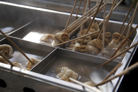 Dumplings on Sticks in Kitchen Metal Container With Steaming Water
