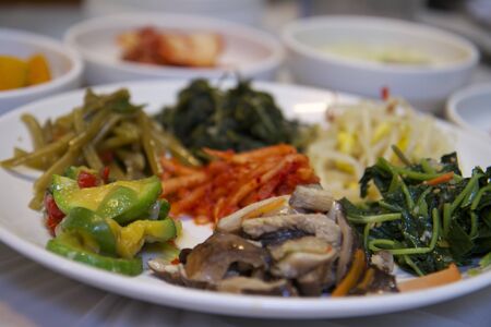 White Porcelain Plate of Korean Food Side Dishesの写真素材