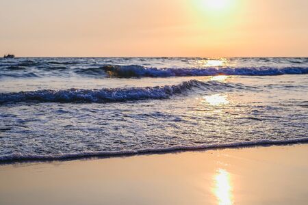 Beautiful sunset over the sea beach with purple blue gold sky, Landscape, Thailand.の写真素材