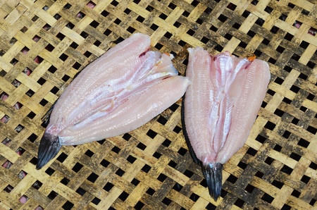 Fish drying on a rack made of bamboo