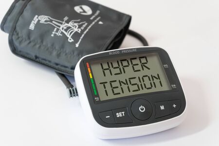Blood pressure arm band with hypertension text. Hypertension concept