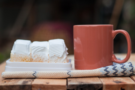 delicious white cake and  coffee cup on wood background.の写真素材
