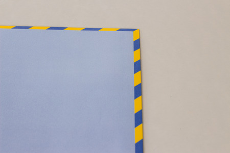 Blue envelope document.The edges are blue and yellow.の写真素材