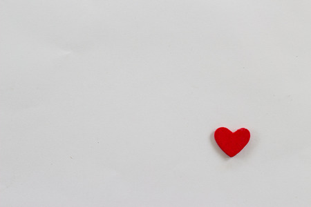 Heart-shaped wooden red on a white background.の写真素材