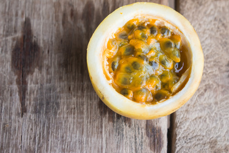 Passion fruits on wooden background