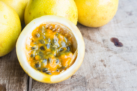 Passion fruits on wooden backgroundの写真素材