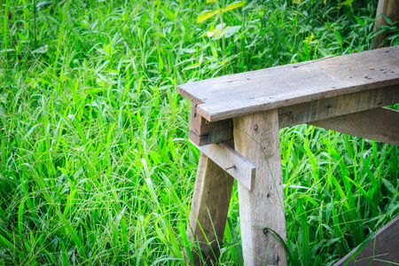 Wooden bench in the gardenの写真素材