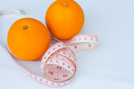 Orange  and measuring tape. Deit conceptの写真素材