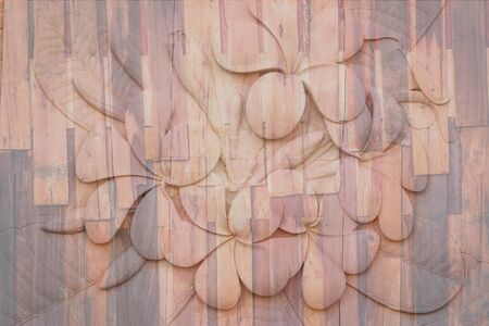 Flowers carved stone walls on wood. backgroundの写真素材