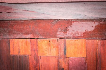 Plates stacked wooden pieces were dark brown wood surface. background ,with vignetteの写真素材