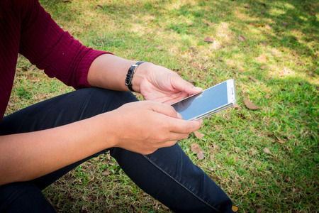 Woman's hand holding a smart phone.