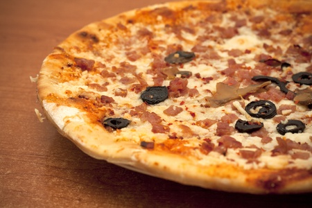 Tasty Italian pizza, just made at home with melting cheeseの写真素材