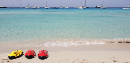 Paraside beach in formentera, ibiza with three electric motorized scuba divingの写真素材
