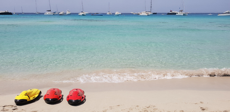 Paraside beach in formentera, ibiza with three electric motorized scuba divingの写真素材
