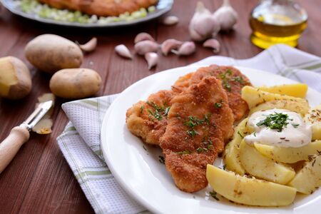 Wiener schnitzel with boiled potatoesの写真素材