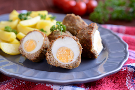 Scotch eggs with boiled potatoesの写真素材