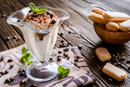 Traditional coffee Tiramisu dessert in a glass jarの写真素材