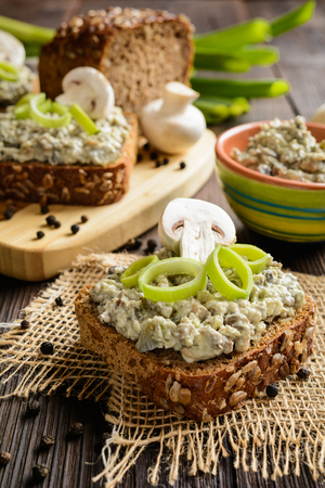 Slice of whole wheat toast with mushroom spread with Roquefort cheese and leekの写真素材