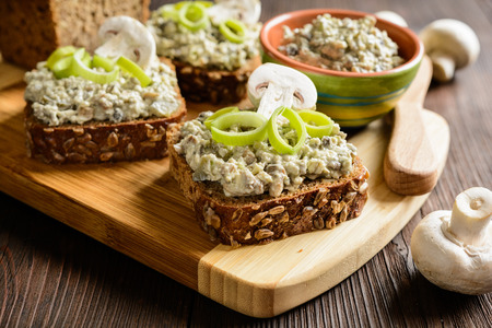 Slice of whole wheat toast with mushroom spread with Roquefort cheese and leekの写真素材