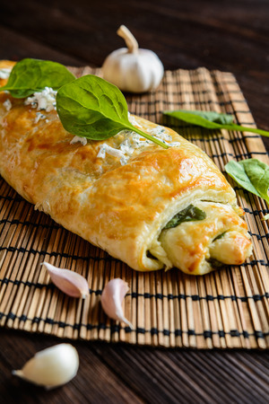 Savory strudel stuffed with spinach, Roquefort, Feta cheese and garlicの写真素材