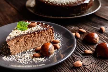 Delicious chestnut cake with almonds and chocolate glazeの写真素材
