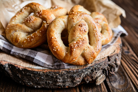 Homemade whole meal pretzels with sesame and saltの写真素材