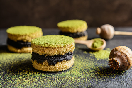 Matcha green tea cakes with poppy seeds fillingの写真素材
