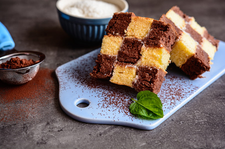 Delicious cocoa chessboard cake with coconut fillingの写真素材