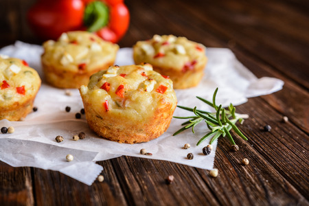 Savory Feta cheese muffins with curd, red bell pepper and herbsの写真素材