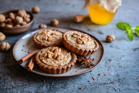 Delicious cocoa gingerbread tartlets with walnut fillingの写真素材