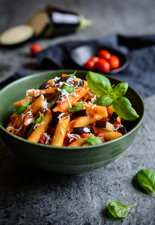 Pasta alla Norma - traditional Italian food with eggplant, tomato, cheese and basilの写真素材