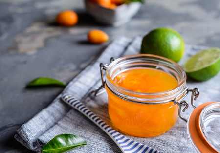 Homemade exotic kumquat jam with mandarins in a glass jarの写真素材