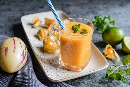 Healthy drink pepino melon and golden berry smoothie in a glass jar