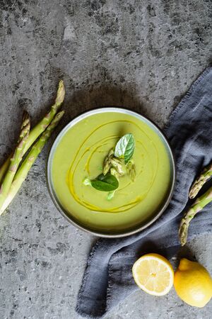 Easy to make creamy asparagus and spinach soup in a ceramic plateの写真素材