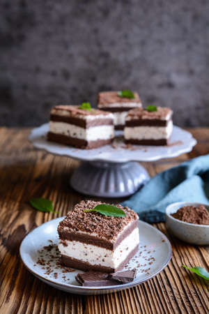 Refreshing Stracciatella cake sprinkled with chocolate shavings served on a ceramic plateの写真素材