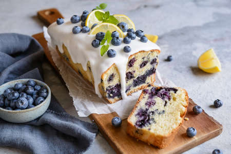 Fresh lemon blueberry loaf of bread cake with sugar glazeの写真素材