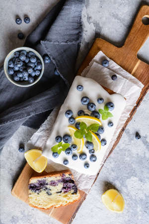 Fresh lemon blueberry loaf of bread cake with sugar glaze