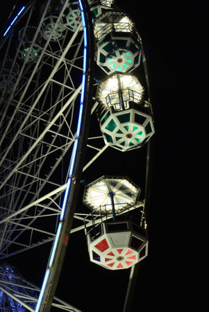 Ferris wheel over dark night skyの写真素材