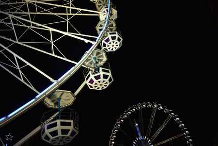 Two ferris wheel over dark night skyのeditorial素材
