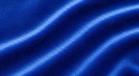 Blue satin fabric texture for background. Top view. Copy space.の素材