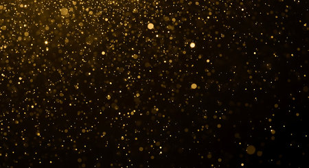 Gold bokeh on black background. Gold glittering abstract backgroundの素材