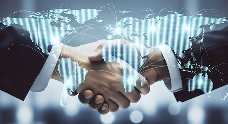 Double exposure of world map hologram and handshake of two men. Partnership concept.の素材