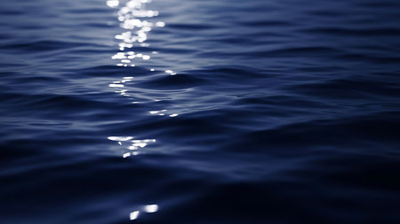 Blue sea water surface with sun reflections close up. Natural background.の素材