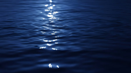 Blue water surface with light reflections in it. Abstract natural background.の素材