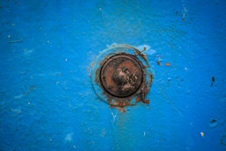 Rusted Bolt, Blue Panelの写真素材
